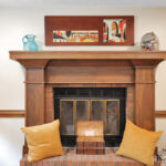 Stunning wooden fireplace in DeWitt Michigan craftsman style remodel from K Fedewa Builders