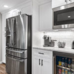 View of fridge and wine fridge in Okemos Michigan kitchen remodel from K Fedewa Builders