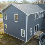 Focus on new blue siding of Owosso Michigan Addition Roofing and Siding