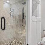 Incredible walk-in shower of St Johns Michigan master bedroom suite bathroom remodel from K Fedewa Builders