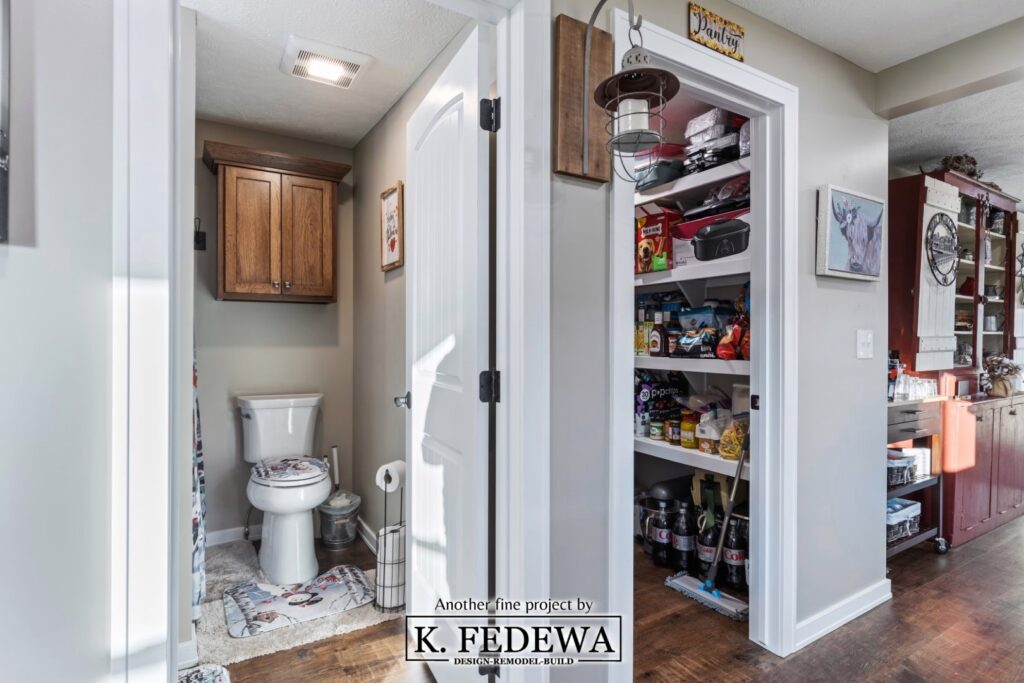 Bathroom and pantry entrances in remodeled kitchen.