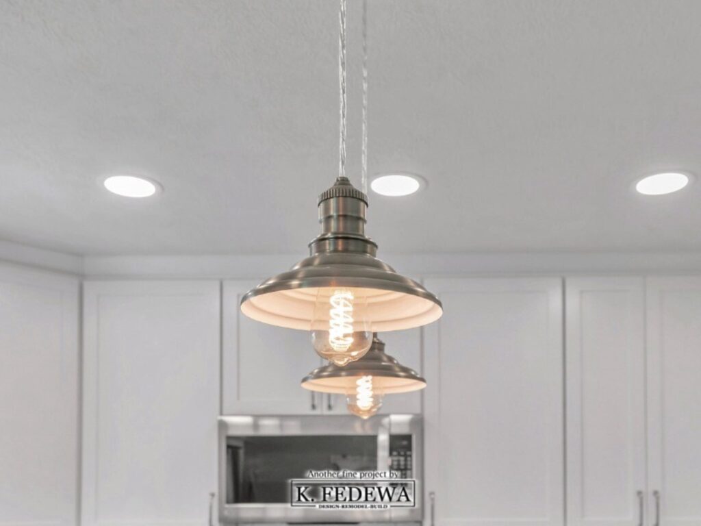 Dock-style lights in refreshed kitchen.