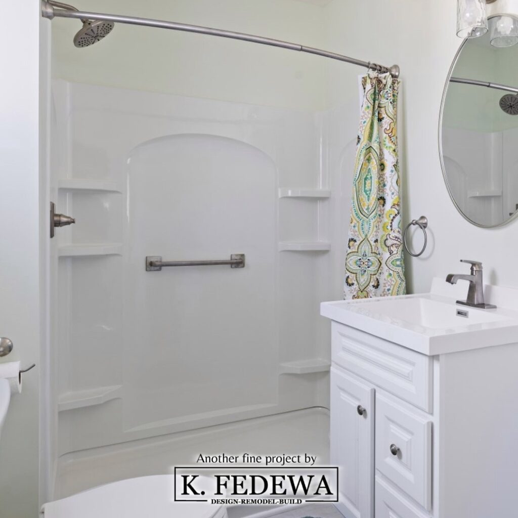 Bathroom with walk-in shower and white vanity for Aging-in-place from K. Fedewa Builders