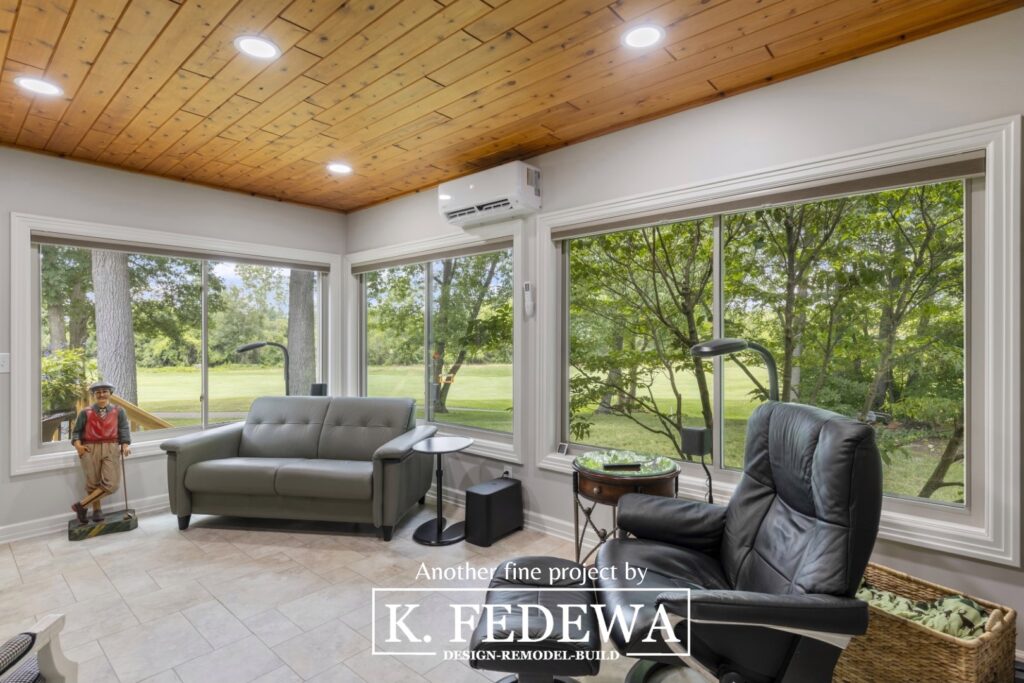 Beautiful four-seasons room in Bath, MI from K. Fedewa Builders with wood ceiling.