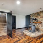Dewitt Michigan Remodeled Basement into Master Suite from K Fedewa Builders - fireplace and stairwell