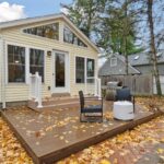 Four Seasons room remodel in East Lansing Michigan by K Fedewa Builders - exterior view showing deck and addition