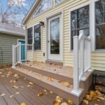 Four Seasons room remodel in East Lansing Michigan by K Fedewa Builders - exterior view close-up of stairs and door