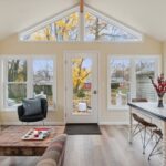 Four Seasons room remodel in East Lansing Michigan by K Fedewa Builders - interior view straight at door and wall of windows