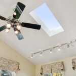 Four season room remodel in Lansing MI by K Fedewa Builders - interior view of sunlight and ceiling fan