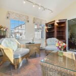 Four season room remodel in Lansing MI by K Fedewa Builders - interior view showing comfortable furniture
