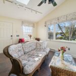 Four season room remodel in Lansing MI by K Fedewa Builders - interior view facing door