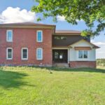 Huge Farmhouse Remodel with Additions in St Johns MI from K Fedewa Builders - Exterior Side of House