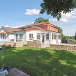 Huge Farmhouse Remodel with Additions in St Johns MI from K Fedewa Builders - Exterior Angle View of Front of House
