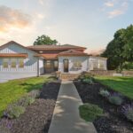 Huge Farmhouse Remodel with Additions in St Johns MI from K Fedewa Builders - Exterior View of Front of House During the Golden Hour