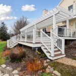 Pergola from K Fedewa Builders in Laingsburg MI - view of entire deck and pergola as if standing on the ground from angle